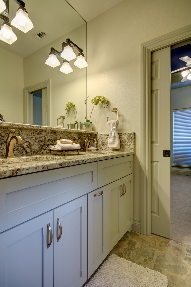 Doorless shower - mid-sized craftsman kids' white tile and ceramic tile porcelain tile doorless shower idea in Austin with an undermount sink, recessed-panel cabinets, beige cabinets, granite countertops, a one-piece toilet and beige walls