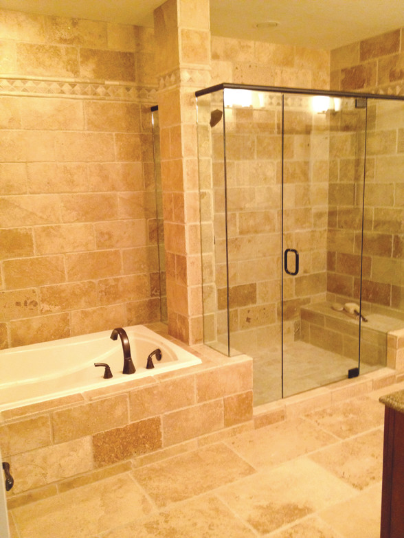 Design ideas for a medium sized traditional shower room bathroom in Atlanta with recessed-panel cabinets, dark wood cabinets, a built-in bath, an alcove shower, beige tiles, stone tiles, white walls, limestone flooring, a submerged sink and granite worktops.