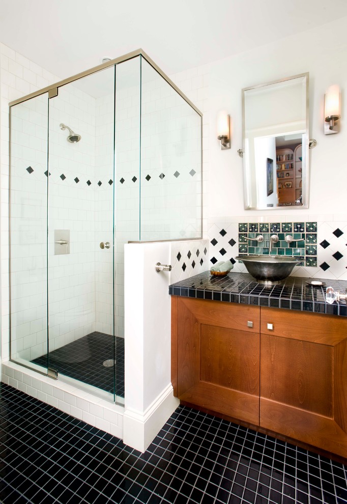 На фото: ванная комната: освещение в стиле модернизм с настольной раковиной и столешницей из плитки
