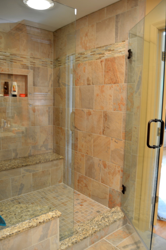 Example of a small transitional master beige tile and porcelain tile porcelain tile alcove shower design in Atlanta with an undermount sink, raised-panel cabinets, medium tone wood cabinets, granite countertops, a one-piece toilet and yellow walls