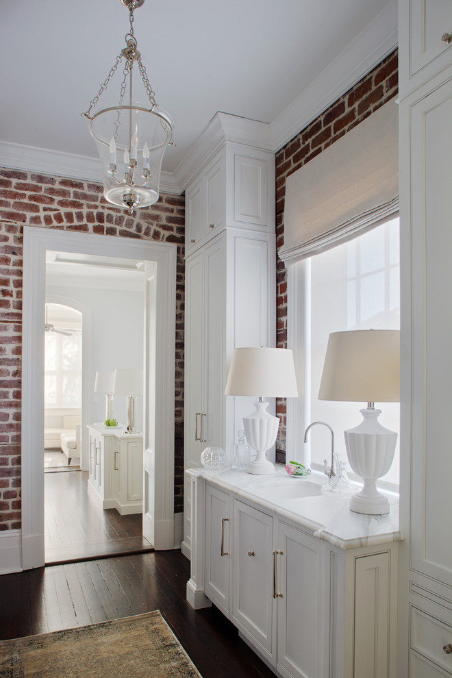 Example of a classic dark wood floor bathroom design in Atlanta with an undermount sink, white cabinets and recessed-panel cabinets