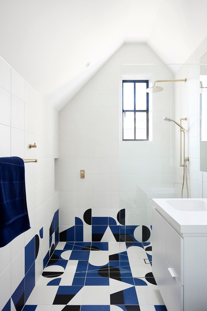 Design ideas for a scandi family bathroom in Melbourne with flat-panel cabinets, white cabinets, multi-coloured tiles, white tiles, white walls, an integrated sink, multi-coloured floors, an open shower and white worktops.