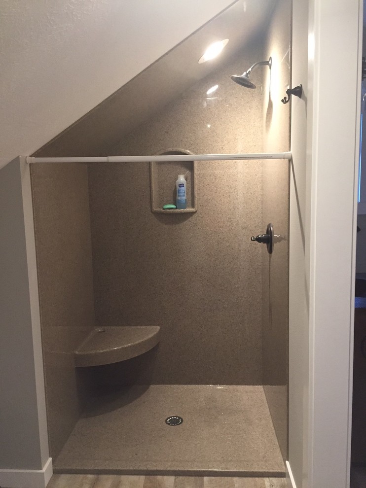 Medium sized rustic shower room bathroom in Milwaukee with freestanding cabinets, dark wood cabinets, an alcove shower, a two-piece toilet, grey walls, medium hardwood flooring, an integrated sink, solid surface worktops, brown floors and a shower curtain.