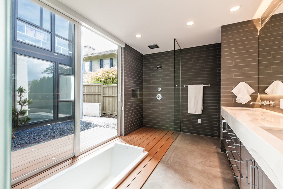 This is an example of a contemporary bathroom in Seattle with a built-in bath.
