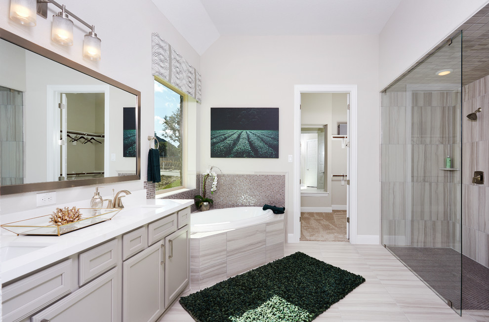 Bathroom - large transitional master beige tile and ceramic tile ceramic tile and beige floor bathroom idea in Austin with beige cabinets, beige walls, an undermount sink, solid surface countertops and recessed-panel cabinets