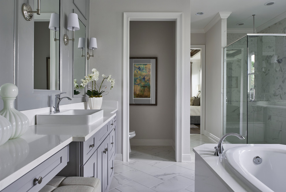 Example of a mid-sized transitional master gray tile and ceramic tile light wood floor alcove shower design in Austin with raised-panel cabinets, dark wood cabinets, multicolored walls, a vessel sink and quartz countertops