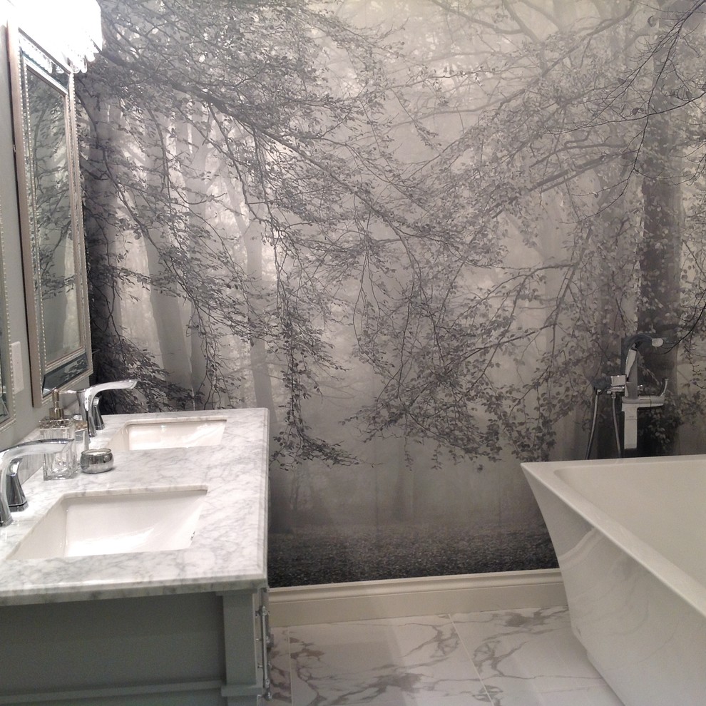 This is an example of a traditional ensuite bathroom in Toronto with grey cabinets, grey walls, marble flooring, a submerged sink, marble worktops, a freestanding bath and white tiles.