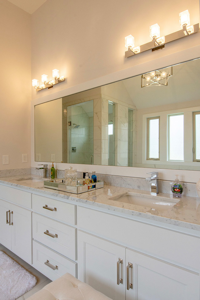 This is an example of a classic ensuite bathroom in Kansas City with shaker cabinets, white cabinets, a freestanding bath, a double shower, a two-piece toilet, white tiles, ceramic tiles, grey walls, ceramic flooring, a submerged sink, granite worktops, white floors, a hinged door and white worktops.