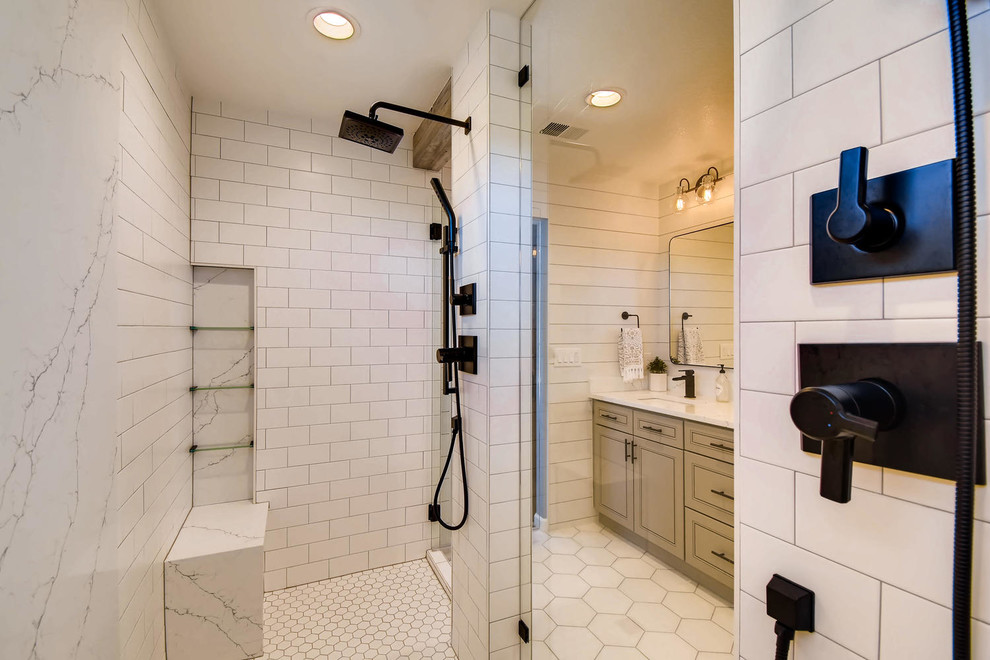 Example of a large farmhouse master white tile and ceramic tile ceramic tile and white floor bathroom design in Denver with shaker cabinets, gray cabinets, white walls, quartz countertops, a hinged shower door and white countertops