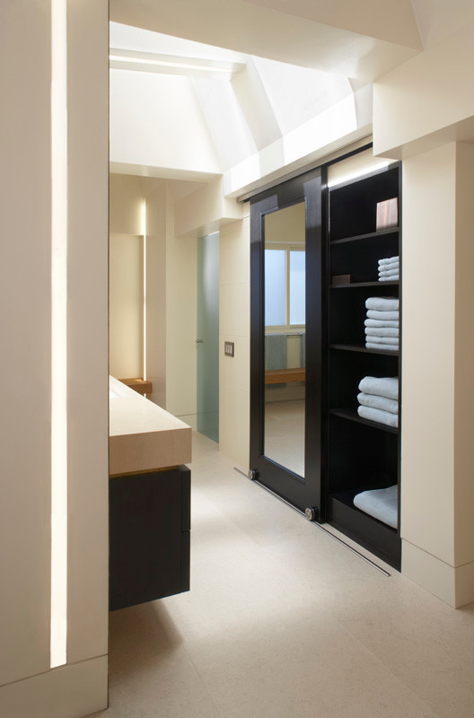 Photo of a modern ensuite bathroom in San Francisco with flat-panel cabinets, black cabinets, a built-in bath, multi-coloured tiles, ceramic tiles, multi-coloured walls, ceramic flooring, beige floors, an open shower and white worktops.
