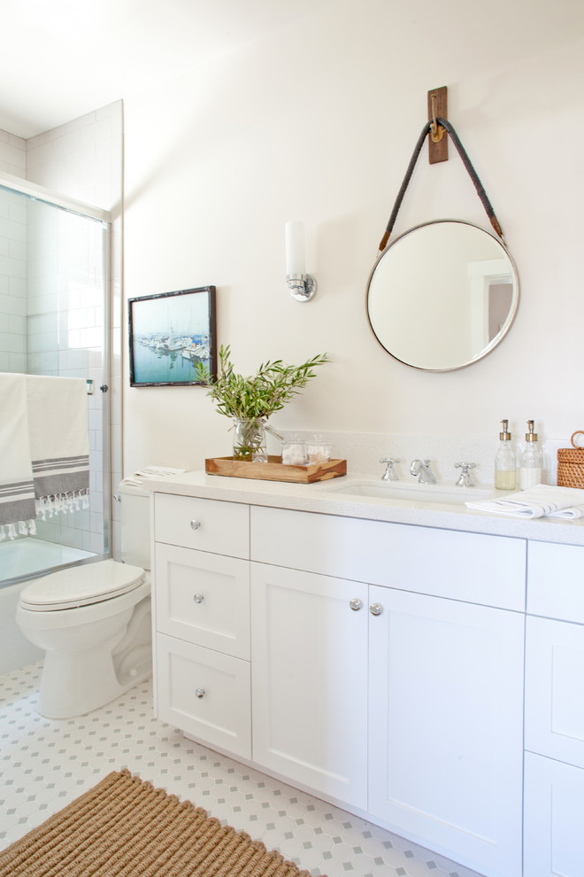 Large country bathroom in Los Angeles with a built-in sink, shaker cabinets, white cabinets, quartz worktops, a corner shower, a one-piece toilet, white tiles, ceramic tiles, white walls and porcelain flooring.