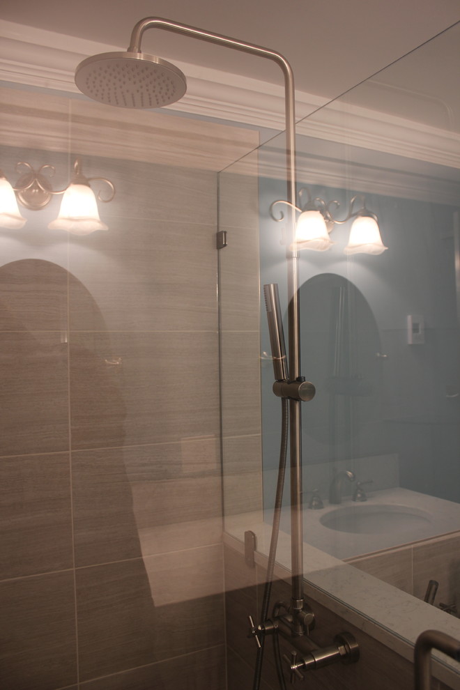 This is an example of a medium sized contemporary ensuite bathroom in Cleveland with shaker cabinets, white cabinets, a built-in bath, a corner shower, brown tiles, blue walls and a submerged sink.