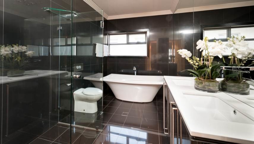 Example of a mid-sized trendy black tile and porcelain tile porcelain tile bathroom design in Adelaide with flat-panel cabinets, black cabinets, quartz countertops and black walls