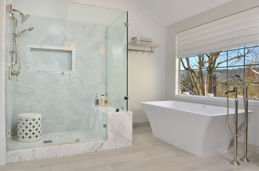Bathroom - large transitional master gray tile and marble tile porcelain tile and gray floor bathroom idea in San Francisco with furniture-like cabinets, gray cabinets, a one-piece toilet, gray walls, an undermount sink, marble countertops, a hinged shower door and gray countertops