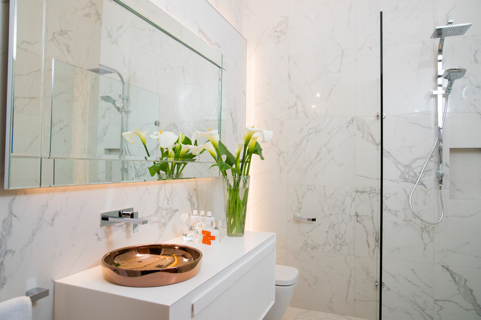 Small contemporary ensuite bathroom in Adelaide with a walk-in shower, a wall mounted toilet, white tiles, porcelain tiles, white walls, porcelain flooring and white floors.