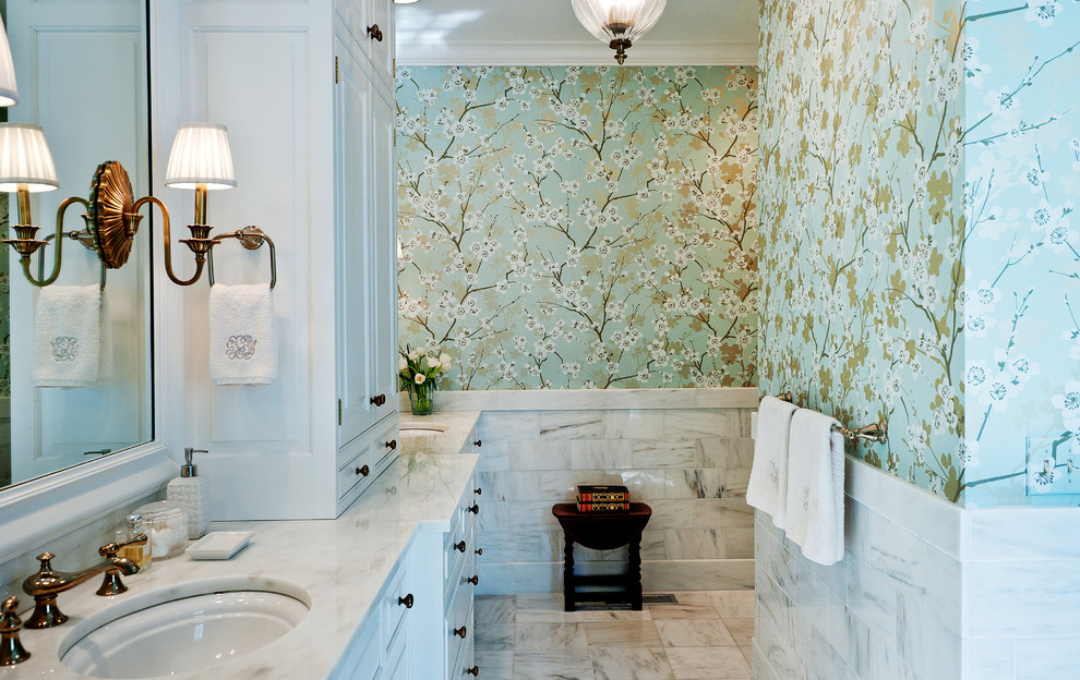 Example of a mid-sized classic marble floor bathroom design in Nashville with marble countertops, an undermount sink, white cabinets and multicolored walls