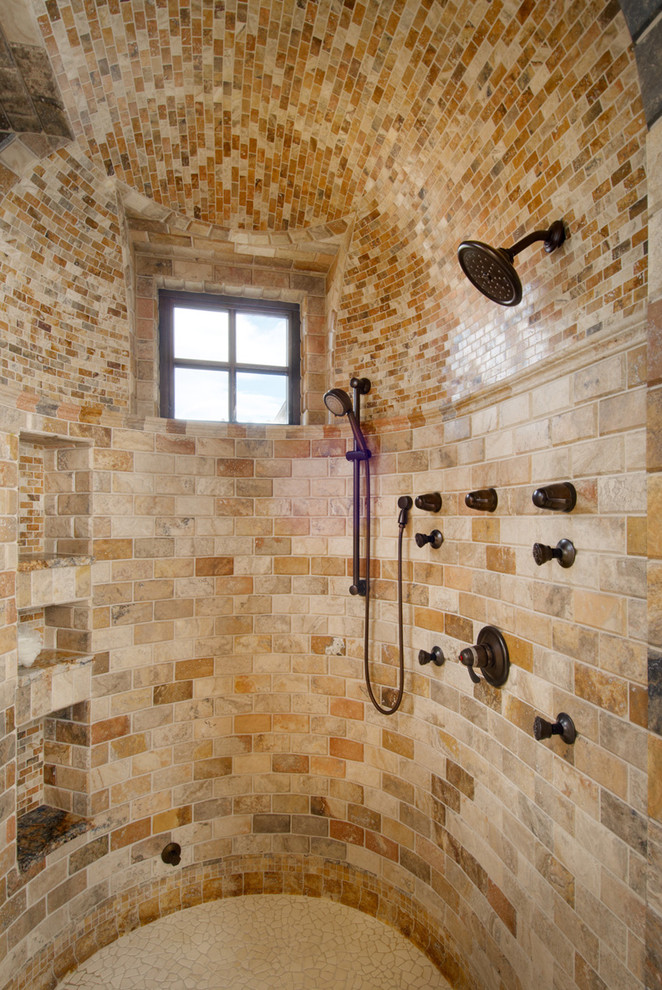 Example of a tuscan beige tile bathroom design in Denver