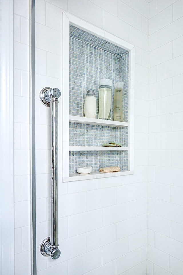 Inspiration for a small traditional shower room bathroom in New York with blue tiles, stone tiles, blue walls and mosaic tile flooring.