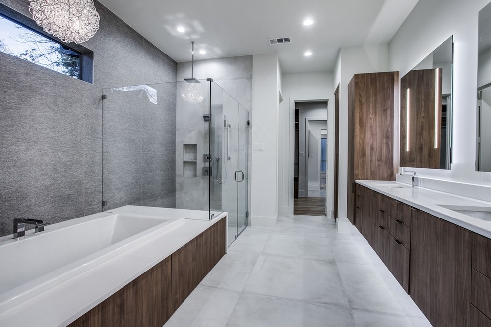Mid-sized trendy master gray tile and cement tile cement tile floor and gray floor bathroom photo in Other with flat-panel cabinets, dark wood cabinets, a two-piece toilet, white walls, an undermount sink, quartz countertops, a hinged shower door and white countertops