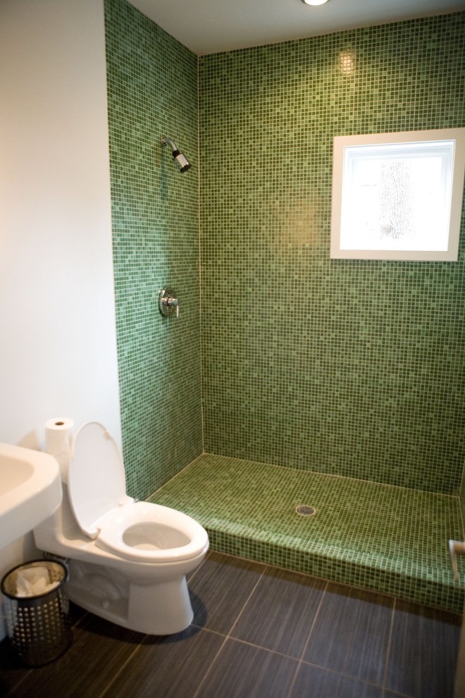 Example of a minimalist green tile and glass tile ceramic tile alcove shower design in Minneapolis with a pedestal sink, a one-piece toilet and white walls