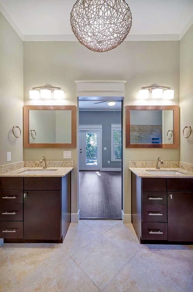 Inspiration for a mid-sized transitional master beige tile and porcelain tile bathroom remodel in Miami with flat-panel cabinets, dark wood cabinets, beige walls, an undermount sink and granite countertops