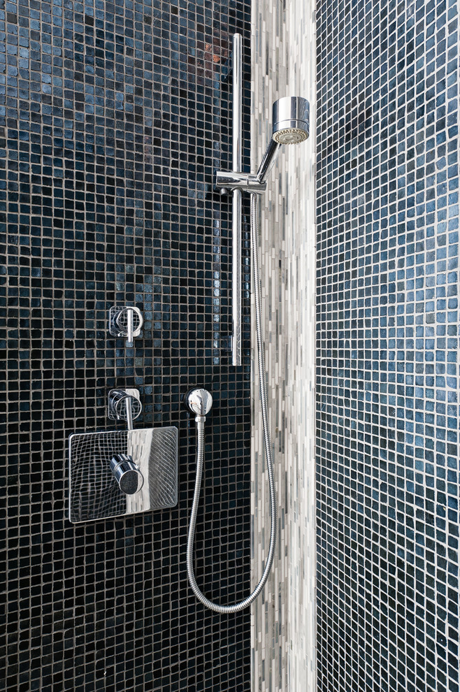 Example of a small trendy master gray tile and mosaic tile marble floor doorless shower design in New York with a wall-mount sink, flat-panel cabinets, dark wood cabinets, a one-piece toilet and gray walls