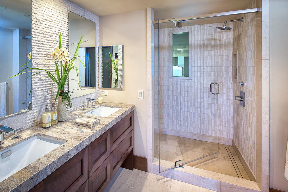 Medium sized contemporary shower room bathroom in Orange County with a submerged sink, shaker cabinets, medium wood cabinets, an alcove shower, beige tiles, stone tiles, beige walls and travertine flooring.