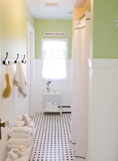 Example of a beach style black and white tile bathroom design in New York