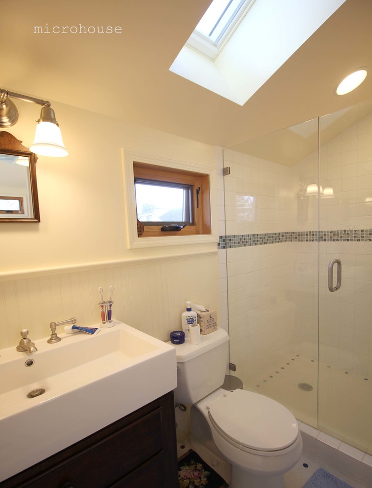 Example of a small mountain style 3/4 white tile and ceramic tile ceramic tile alcove shower design in Seattle with furniture-like cabinets, dark wood cabinets, a two-piece toilet, white walls and a console sink