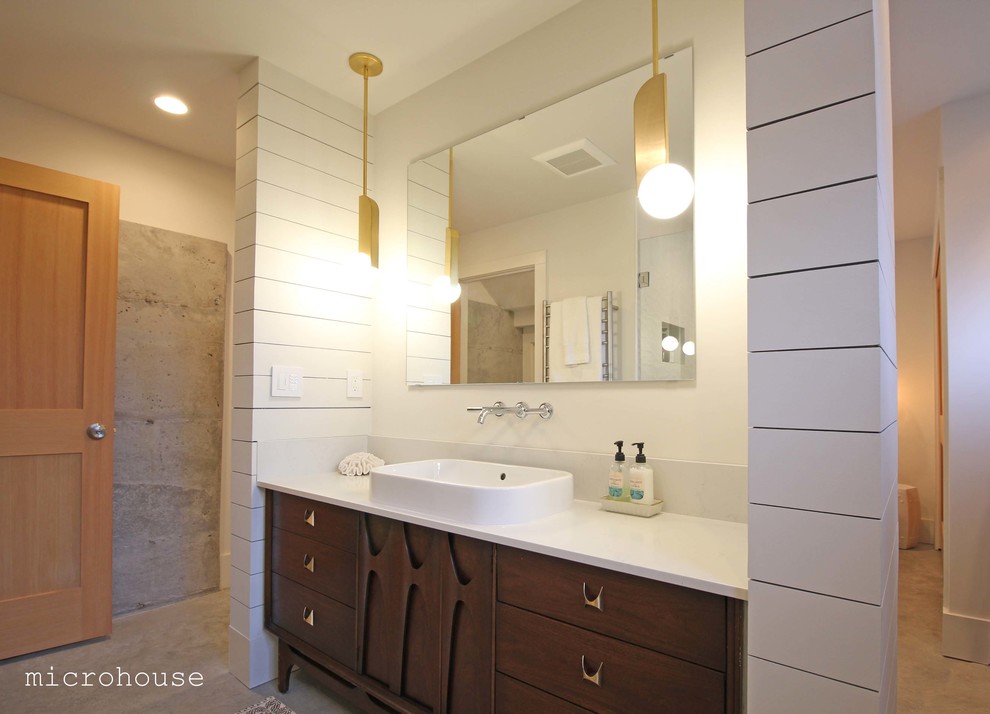 Design ideas for a small contemporary ensuite bathroom in Seattle with freestanding cabinets, dark wood cabinets, an alcove shower, a wall mounted toilet, white walls, concrete flooring, a vessel sink, quartz worktops, grey floors, an open shower and white worktops.