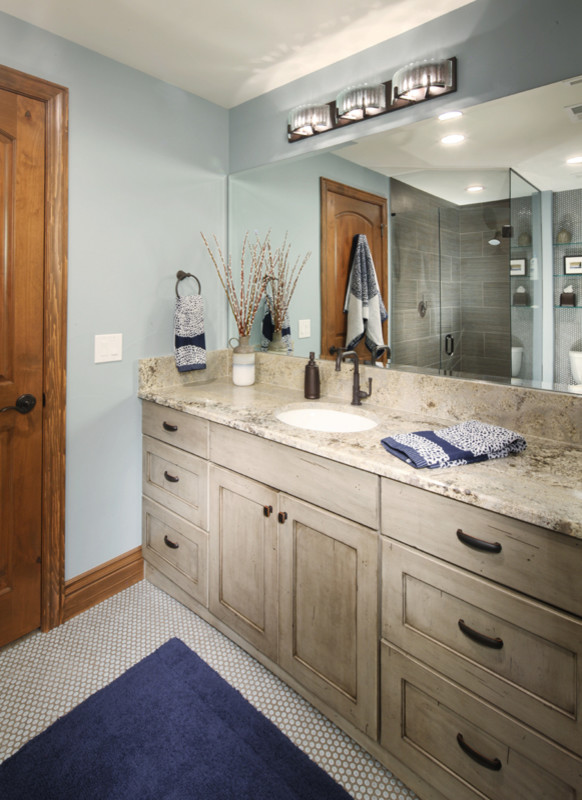 Mid-sized trendy 3/4 gray tile and ceramic tile ceramic tile corner shower photo in Dallas with distressed cabinets, a one-piece toilet, blue walls, an undermount sink and granite countertops
