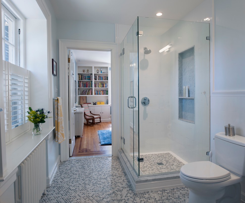 Mid-sized transitional kids' white tile and ceramic tile ceramic tile and white floor corner shower photo in Philadelphia with shaker cabinets, medium tone wood cabinets, a two-piece toilet, white walls, an undermount sink, granite countertops and a hinged shower door