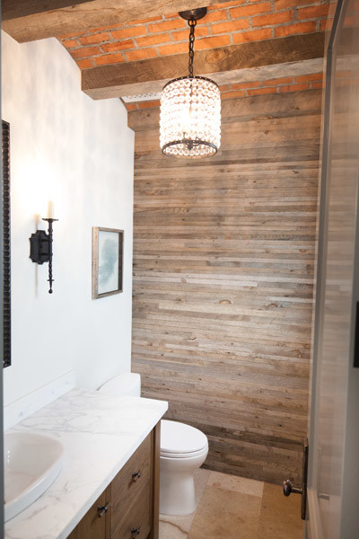 Design ideas for a beach style shower room bathroom in Orange County with white walls, a built-in sink and light hardwood flooring.