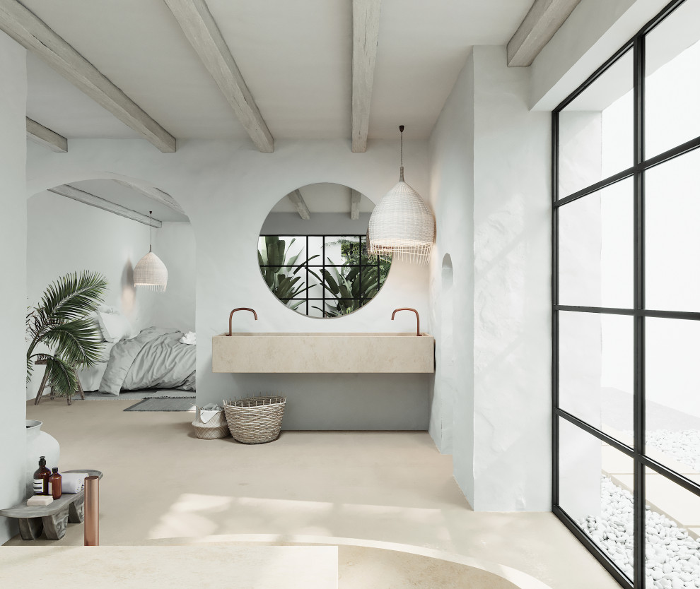 Esempio di una stanza da bagno tropicale con vasca freestanding, pavimento in marmo e pavimento beige