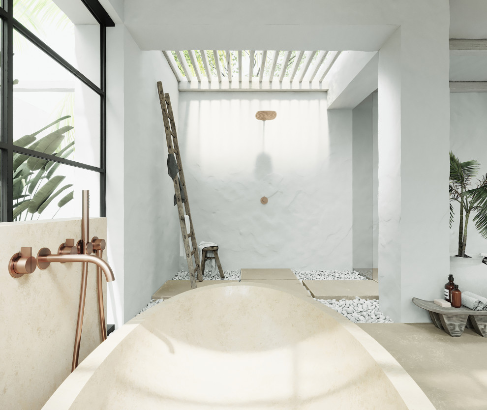 Foto de cuarto de baño exótico con bañera exenta, suelo de mármol y suelo beige