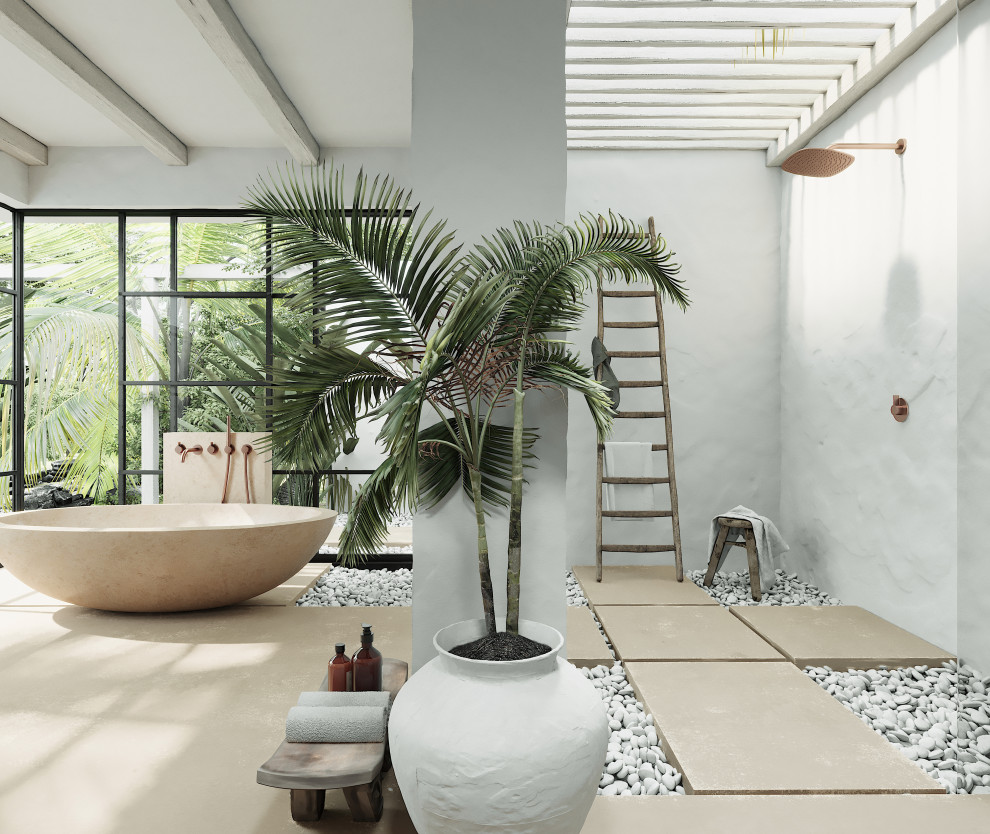 Idee per una stanza da bagno tropicale con vasca freestanding, pavimento in marmo e pavimento beige