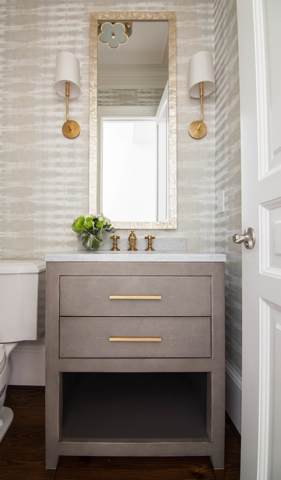 Small traditional shower room bathroom in Atlanta with freestanding cabinets, green cabinets, a one-piece toilet, multi-coloured walls, dark hardwood flooring, a built-in sink, marble worktops, brown floors and white worktops.