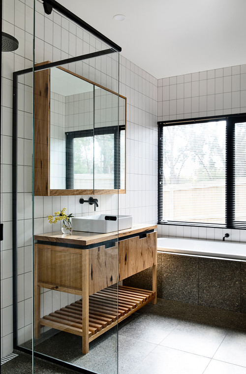 Modern Twist with Vertical Subway Tiles and Rustic Wood Vanity