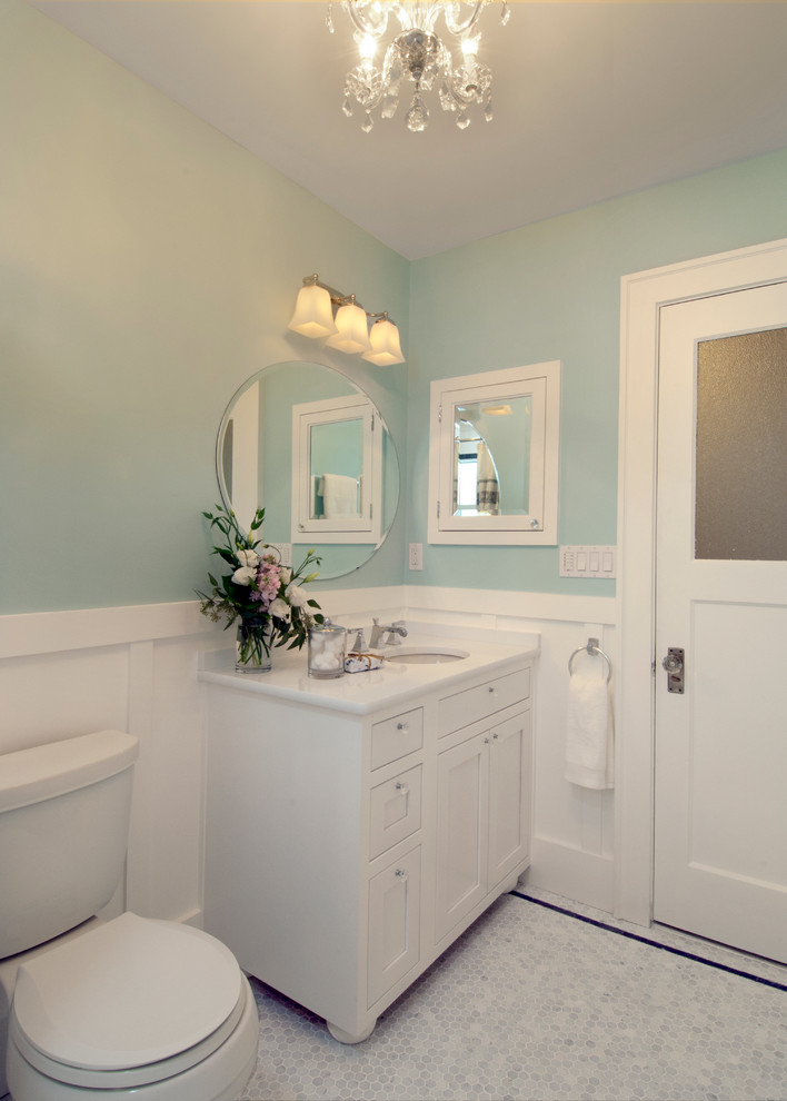 Medium sized traditional ensuite bathroom in Seattle with shaker cabinets, white cabinets, an alcove shower, a one-piece toilet, white tiles, ceramic tiles, blue walls, mosaic tile flooring, a submerged sink, quartz worktops, white floors and white worktops.