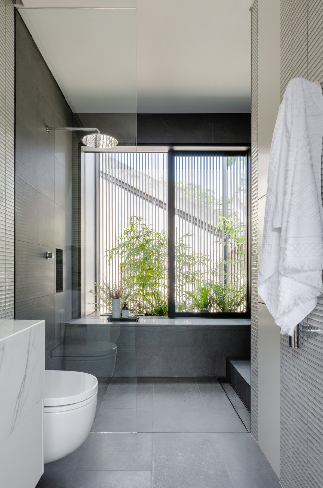 This is an example of a contemporary bathroom in Sydney with a walk-in shower.