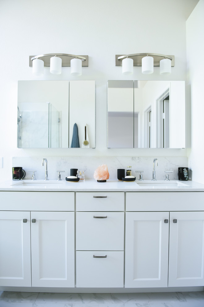 Large contemporary ensuite bathroom in San Diego with shaker cabinets, white cabinets, a freestanding bath, a walk-in shower, a two-piece toilet, white tiles, porcelain tiles, white walls, porcelain flooring, a submerged sink, engineered stone worktops, white floors, a hinged door and white worktops.
