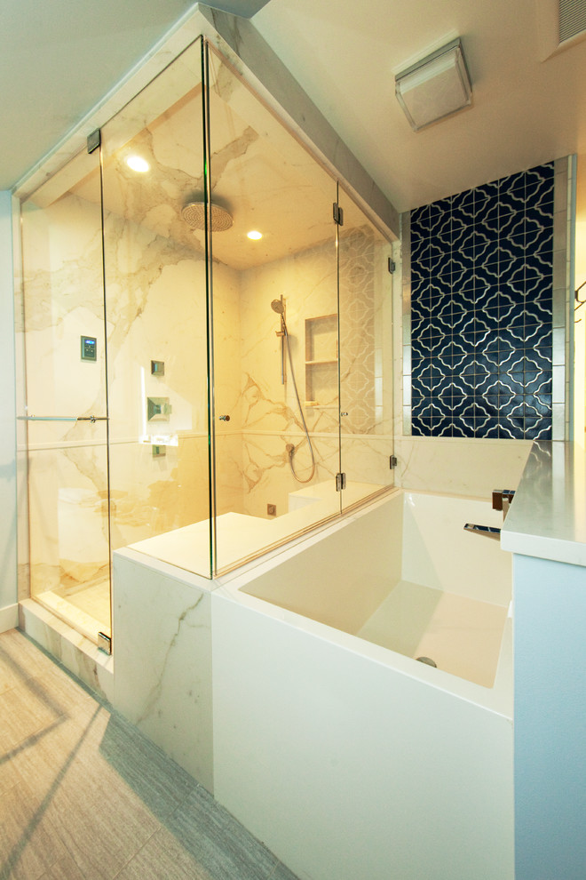 Example of a large trendy master white tile bathroom design in Seattle with an undermount sink, furniture-like cabinets, medium tone wood cabinets, quartz countertops, a bidet and white walls