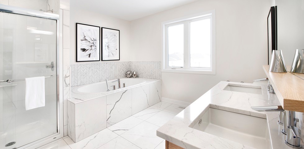 Inspiration for a medium sized modern ensuite bathroom in Ottawa with flat-panel cabinets, light wood cabinets, a built-in bath, an alcove shower, white tiles, ceramic tiles, white walls, ceramic flooring, a submerged sink and quartz worktops.