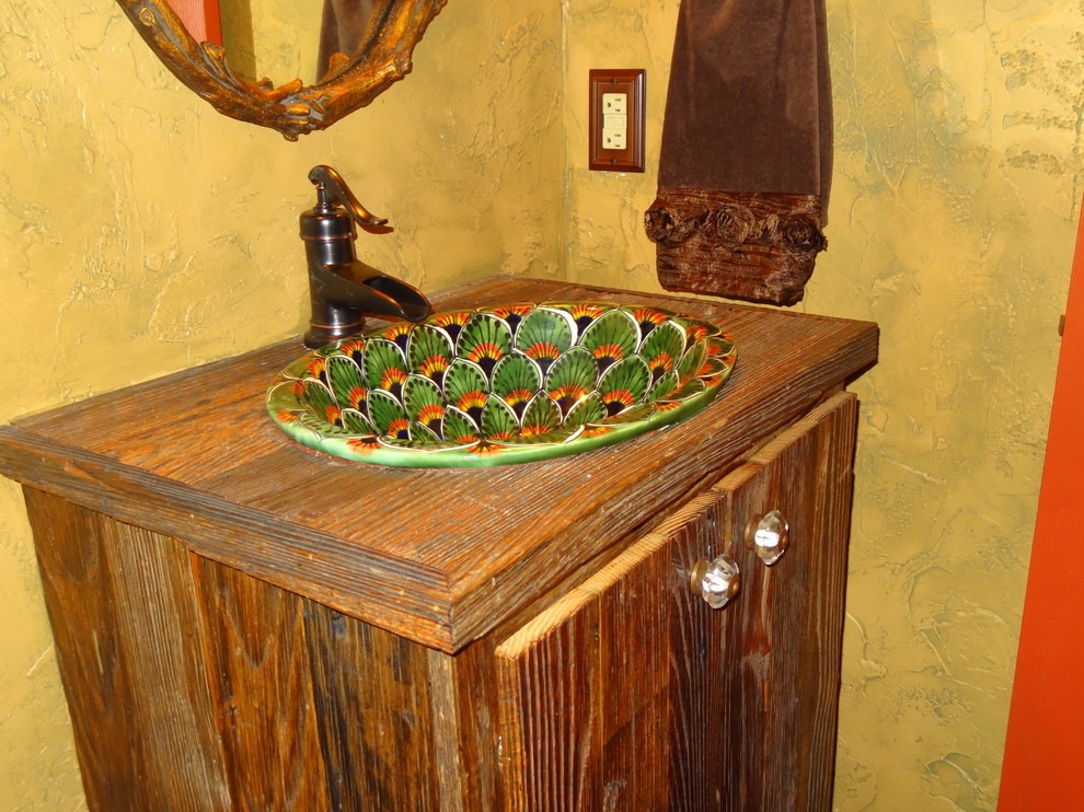 Idée de décoration pour une petite salle de bain chalet en bois foncé avec un lavabo posé, un placard en trompe-l'oeil, un plan de toilette en bois, WC séparés, un carrelage multicolore, des carreaux de céramique, un mur jaune et un sol en bois brun.