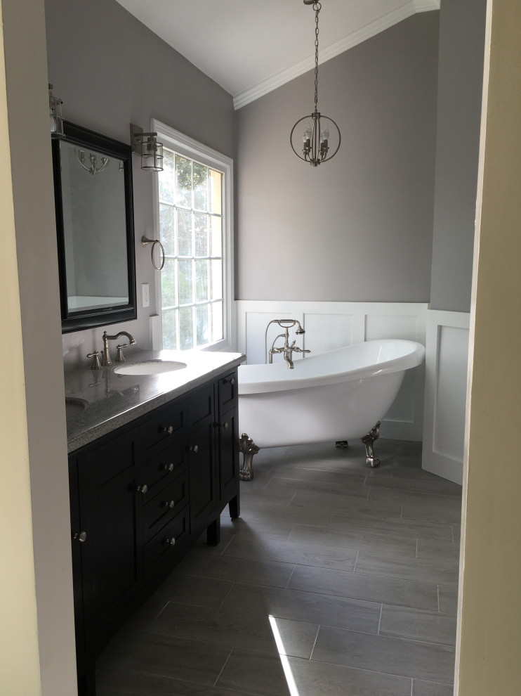 This is an example of a large classic ensuite bathroom in Atlanta with shaker cabinets, black cabinets, a claw-foot bath, an alcove shower, black and white tiles, cement tiles, grey walls, cement flooring, a submerged sink, marble worktops, grey floors, a hinged door and white worktops.