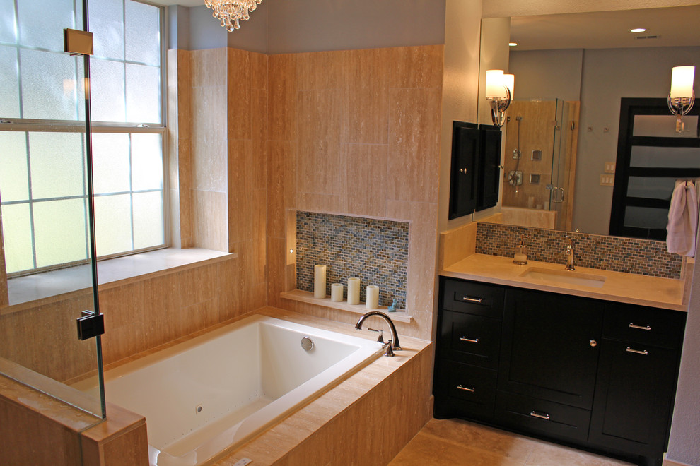Inspiration for a medium sized classic ensuite bathroom in Austin with shaker cabinets, dark wood cabinets, limestone worktops, blue tiles, glass tiles, a built-in bath, a corner shower, a submerged sink, blue walls and travertine flooring.