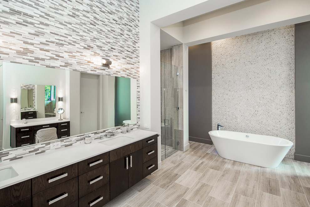 Bathroom - huge contemporary master multicolored tile and mosaic tile porcelain tile and beige floor bathroom idea in Austin with flat-panel cabinets, dark wood cabinets, white walls, an undermount sink, quartz countertops, a hinged shower door and white countertops
