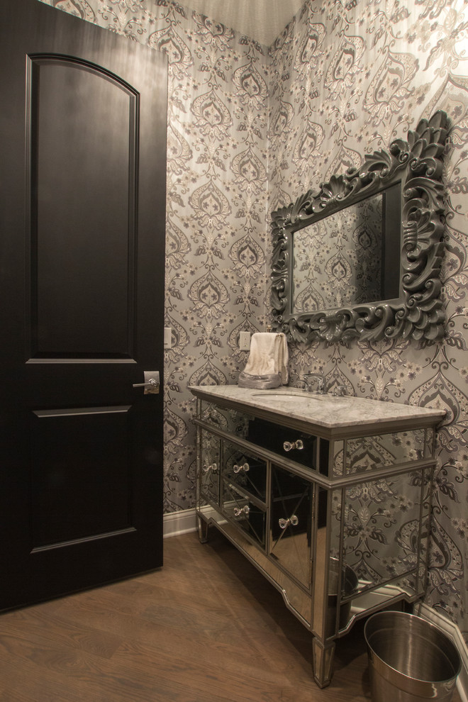 This is an example of a small contemporary shower room bathroom in Minneapolis with glass-front cabinets, marble worktops, light hardwood flooring, a built-in sink, a two-piece toilet and grey walls.