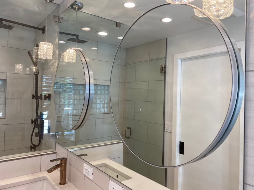 Photo of a modern ensuite bathroom in Seattle with flat-panel cabinets, distressed cabinets, a built-in shower, a submerged sink, engineered stone worktops, a hinged door, white worktops, double sinks and a floating vanity unit.