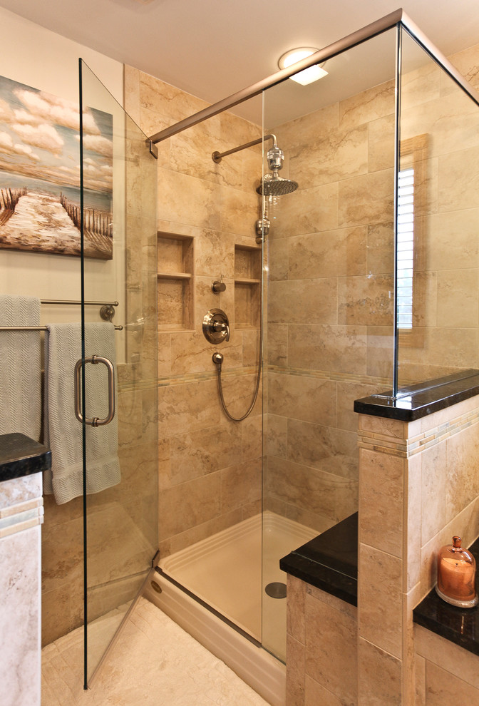 Bathroom - mid-sized transitional master beige tile and porcelain tile porcelain tile and beige floor bathroom idea in Chicago with shaker cabinets, medium tone wood cabinets, beige walls, an undermount sink, granite countertops and a hinged shower door
